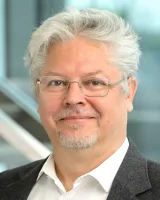 Dr. Denis Havlik